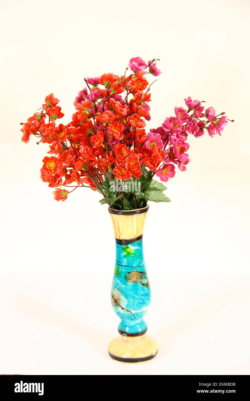 artistic vase with flowers on white background Stock Photo