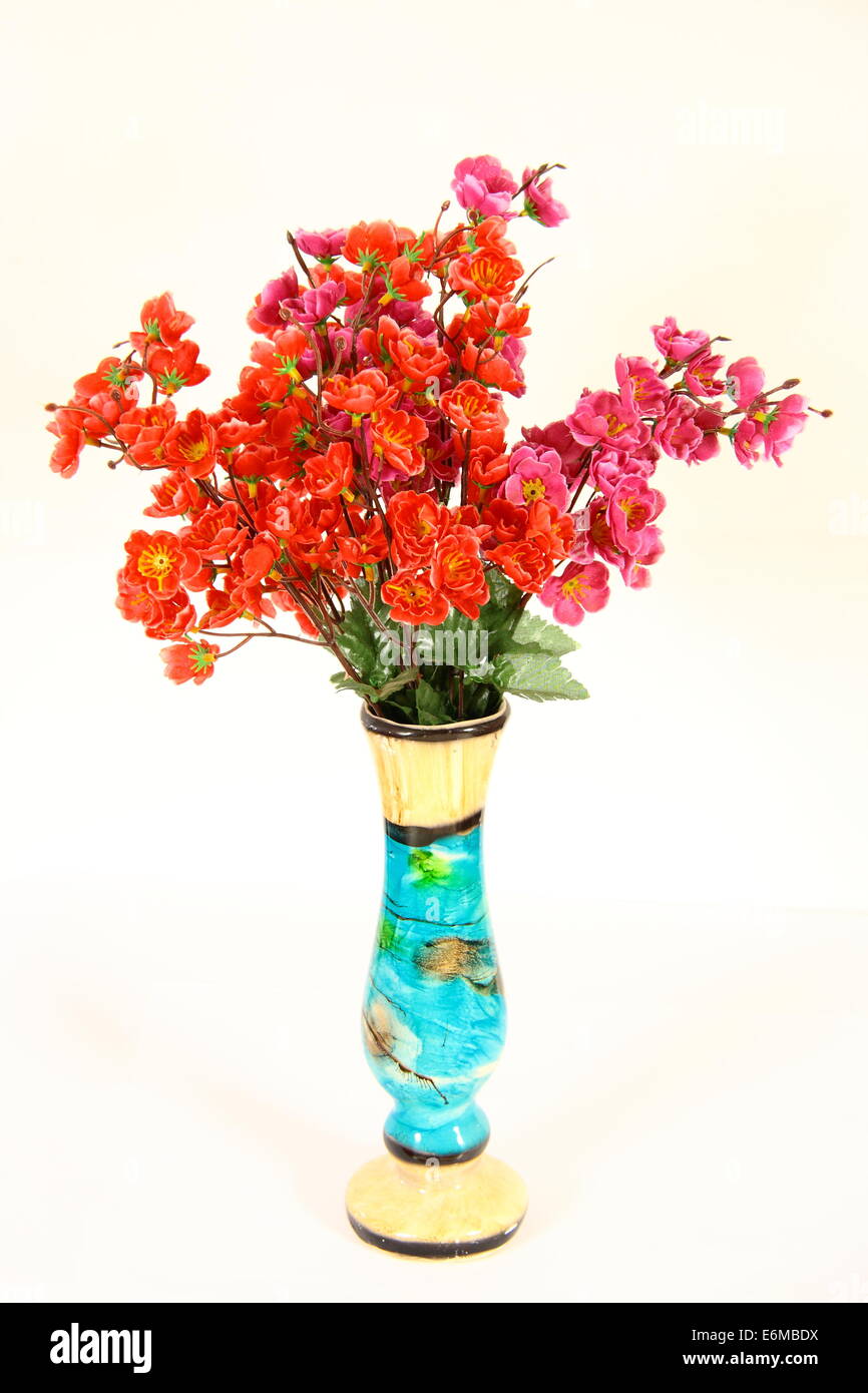 artistic vase with flowers on white background Stock Photo