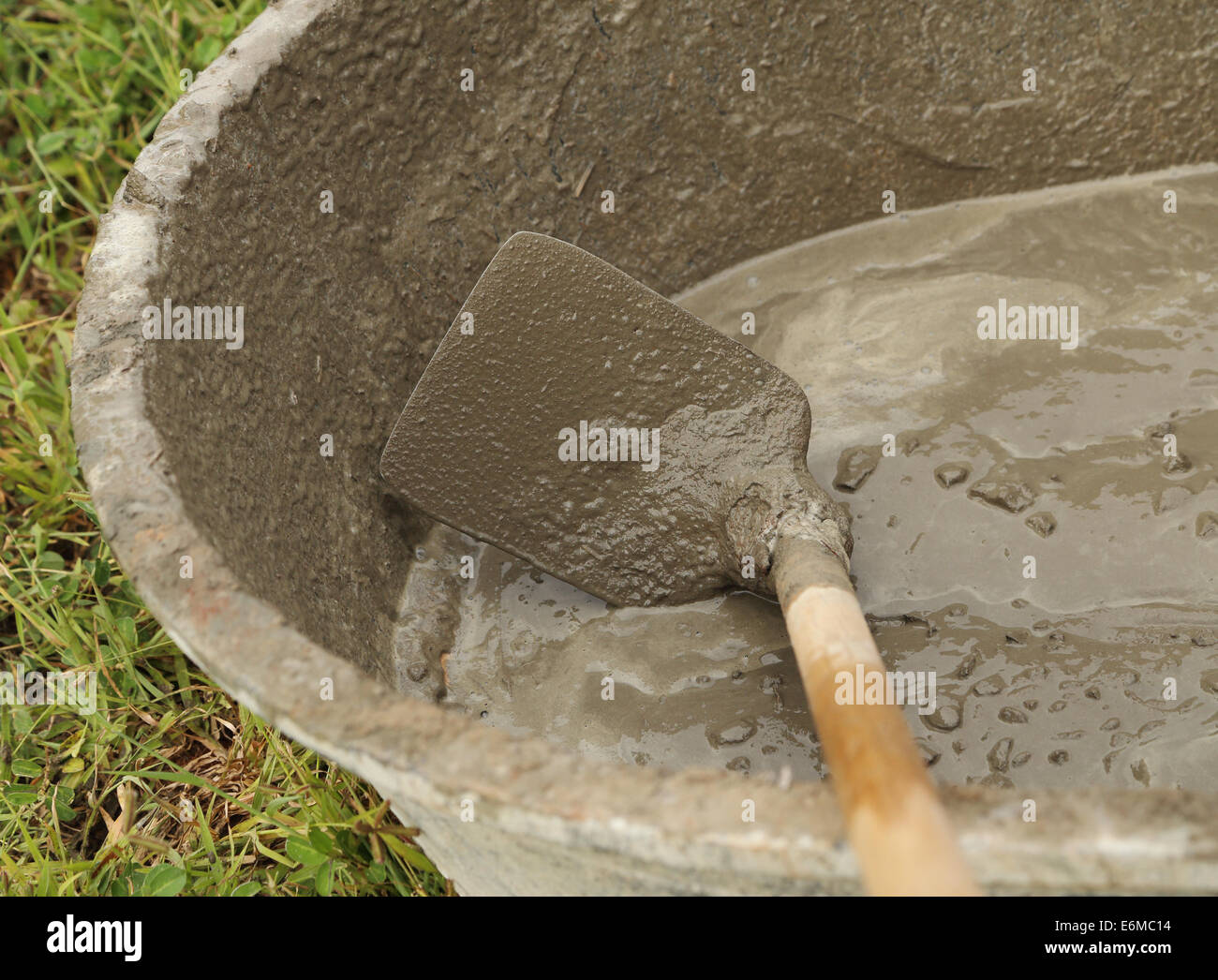 cement mix concrete is compacted sand by spade for construction Stock Photo  - Alamy