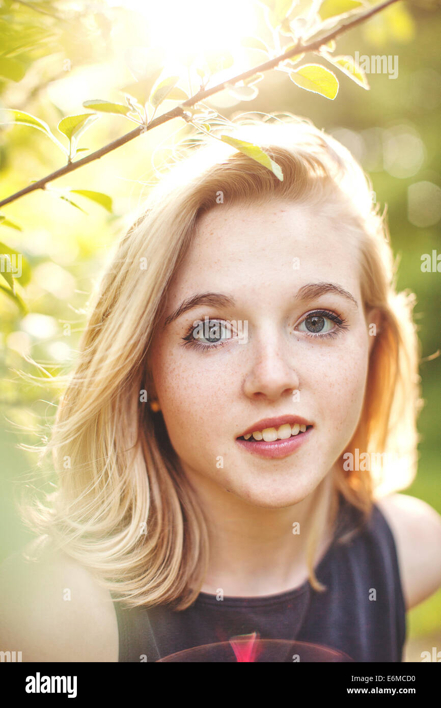 Portrait of young woman in forest Stock Photo - Alamy