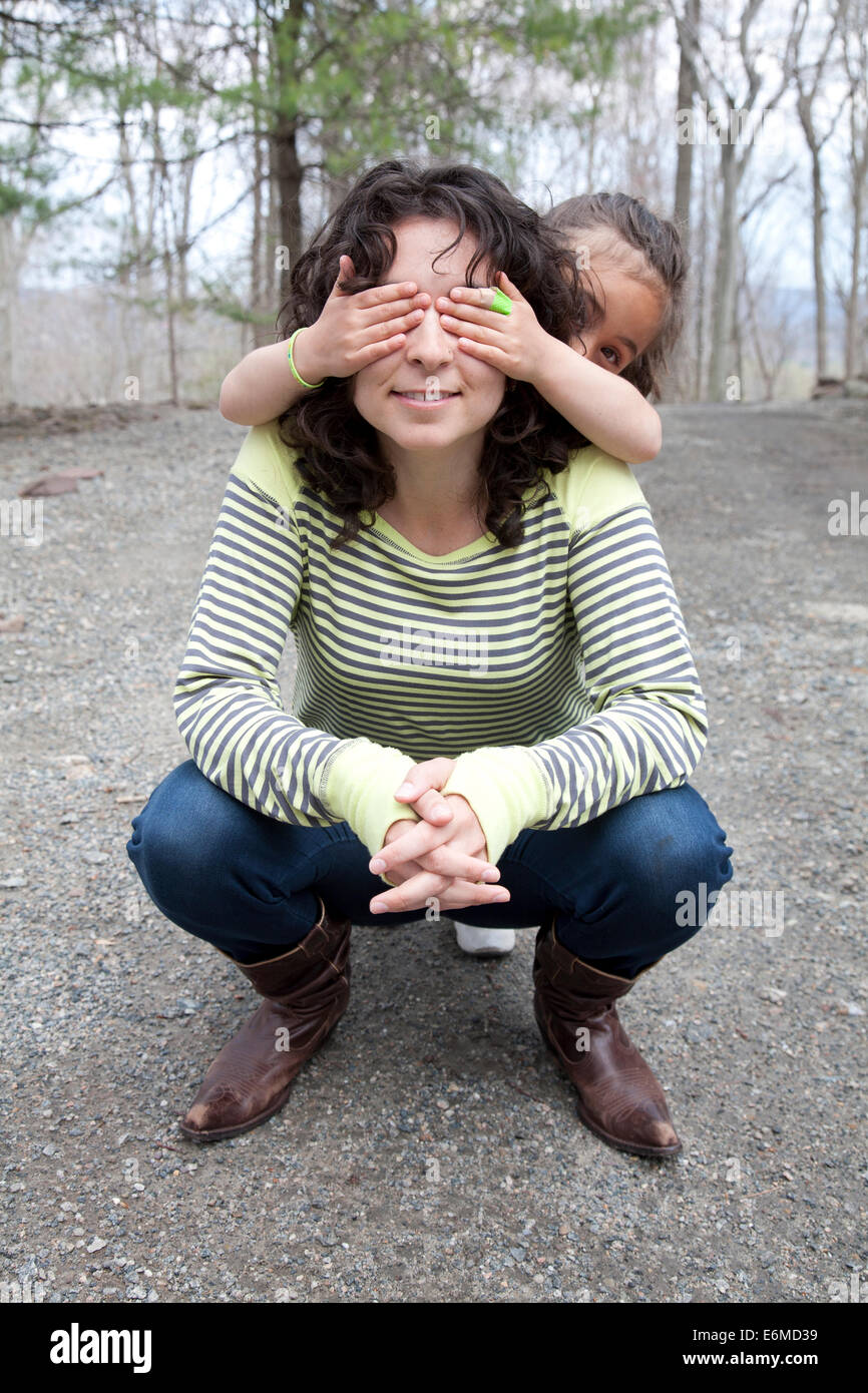 Portrait of mother and daughter (4-5) on sidewalk Stock Photo