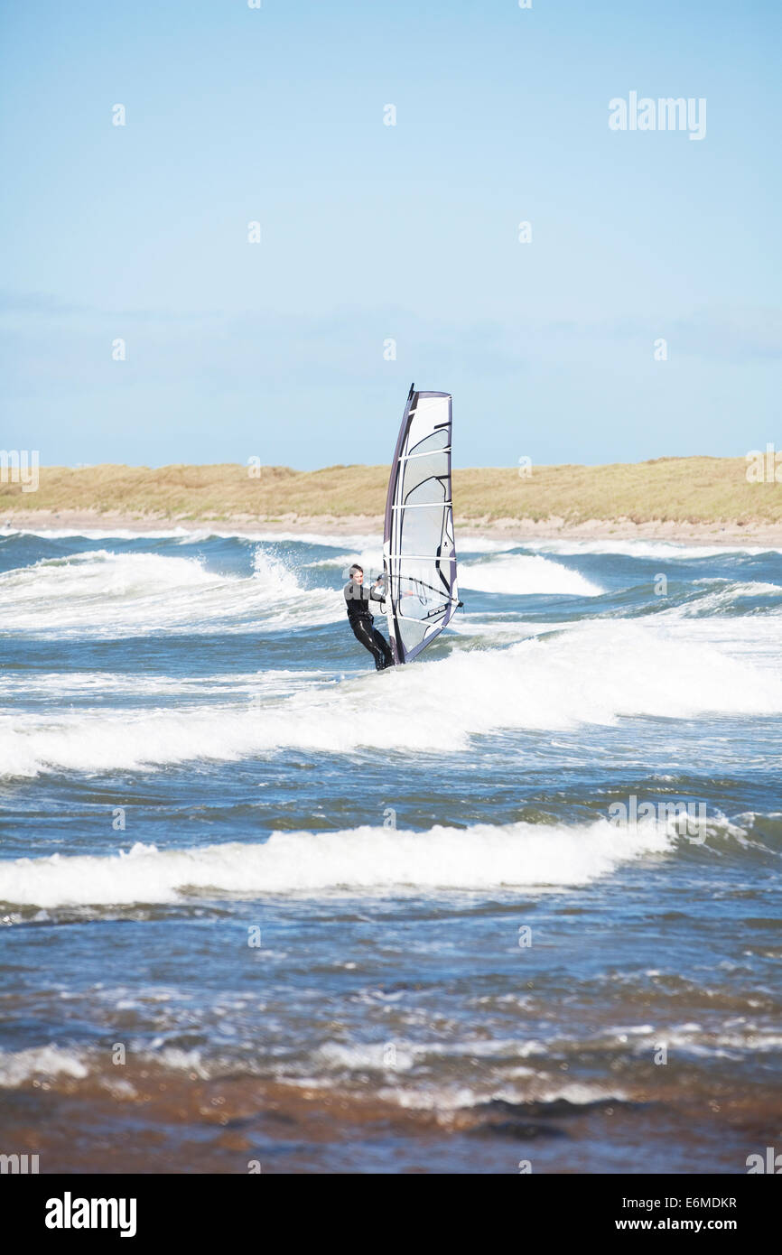 windsurfing on Cymyran beach, Rhosneigr, Anglesey, North Wales Stock
