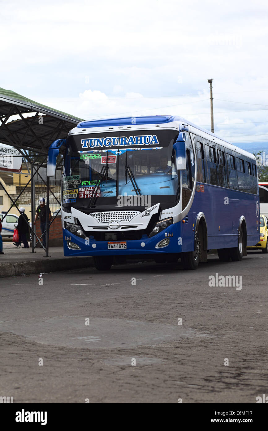 A local bus on Segunda Constituyente Street outside the Terminal Intercantonal Mercado America in Ambato, Ecuador Stock Photo