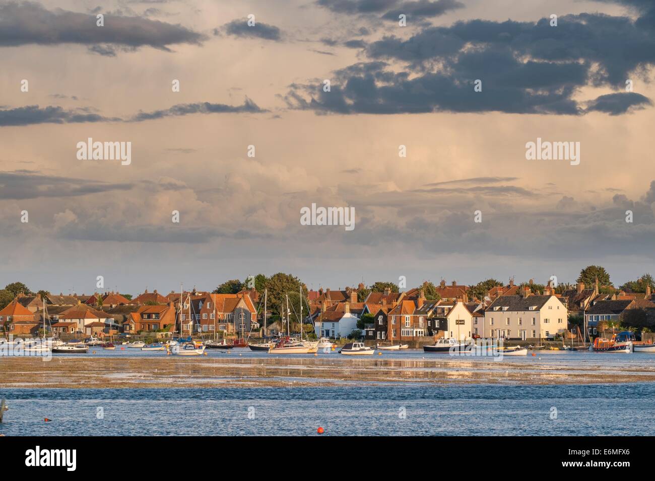 View of Wells harbour showing the tide encroaching on the saltmarsh. Stock Photo