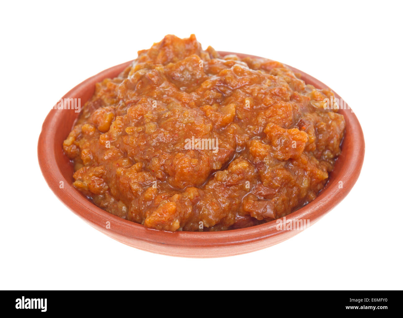 A small bowl filled with chili used for a condiment for hot dogs. Stock Photo
