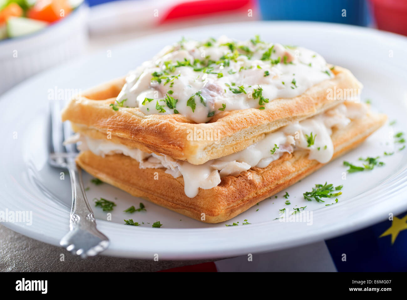 A plate of traditional Acadian creamed haddock and waffles. Stock Photo