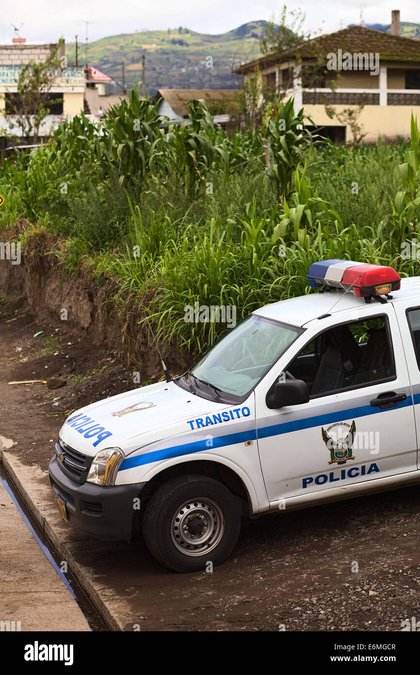 TUNGURAHUA PROVINCE, ECUADOR - MAY 12, 2014: Car of the traffic police standing on the roadside along the road Stock Photo