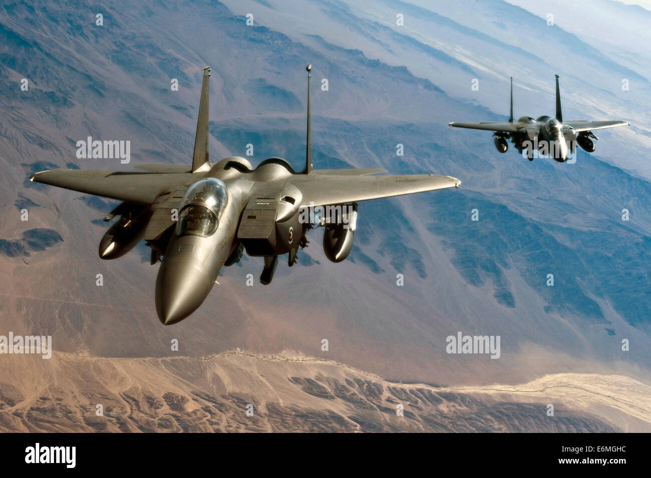 US Air Force F-15E Strike Eagle fighters fly in formation during Green Flag West training exercise June 22, 2011 over Southern California. Stock Photo