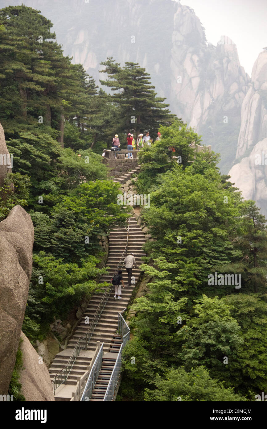 Tourists hike the Yellow Mountain in the Anhui province, China. Stock Photo
