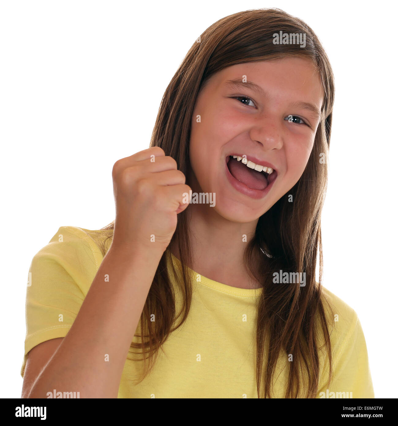Successful girl clenching fist when winning, isolated on a white background Stock Photo