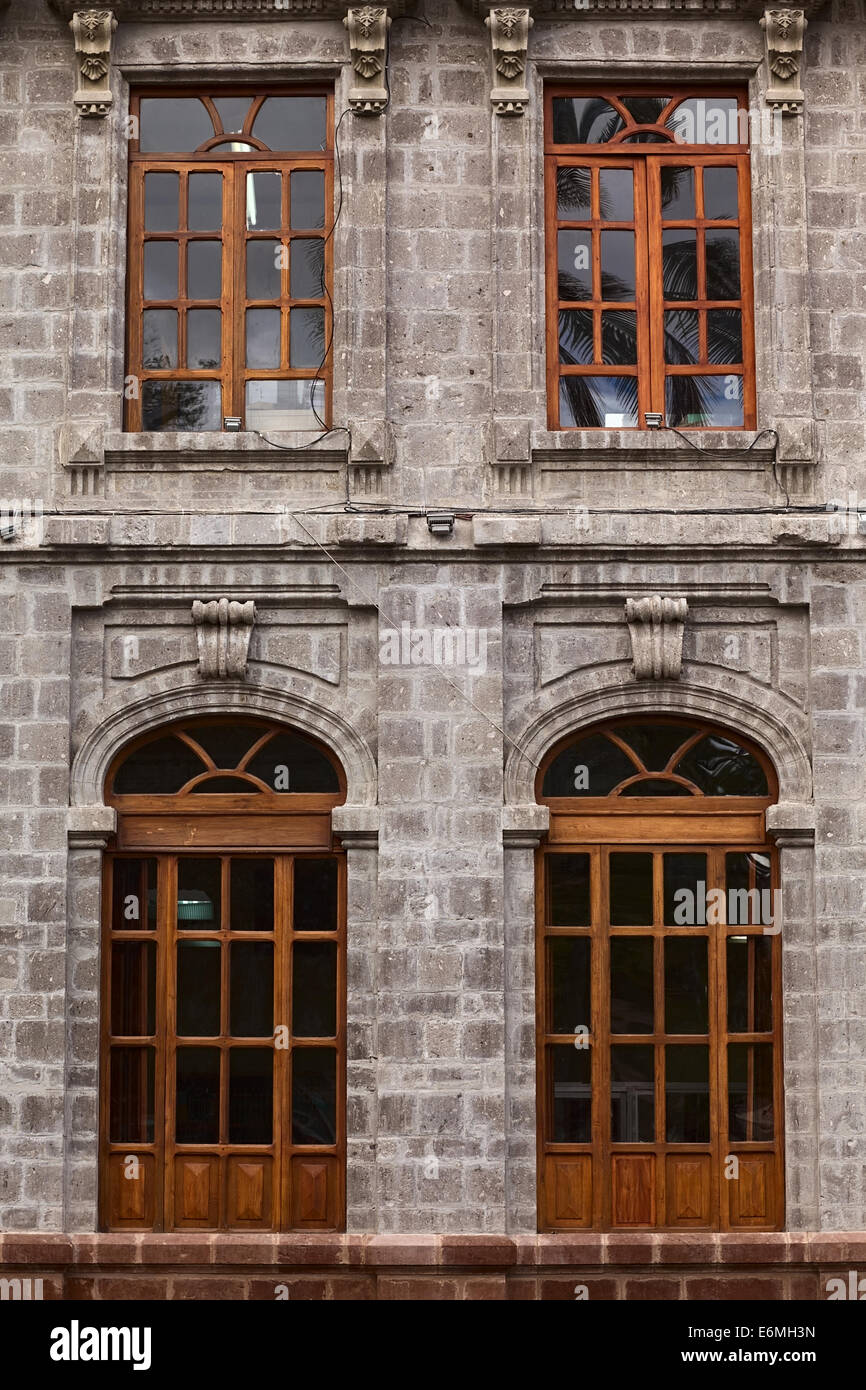 AMBATO, ECUADOR - JUNE 23, 2014: Windows of the building of the Instituto Tecnologico Superior Bolivar at Cevallos Park Stock Photo
