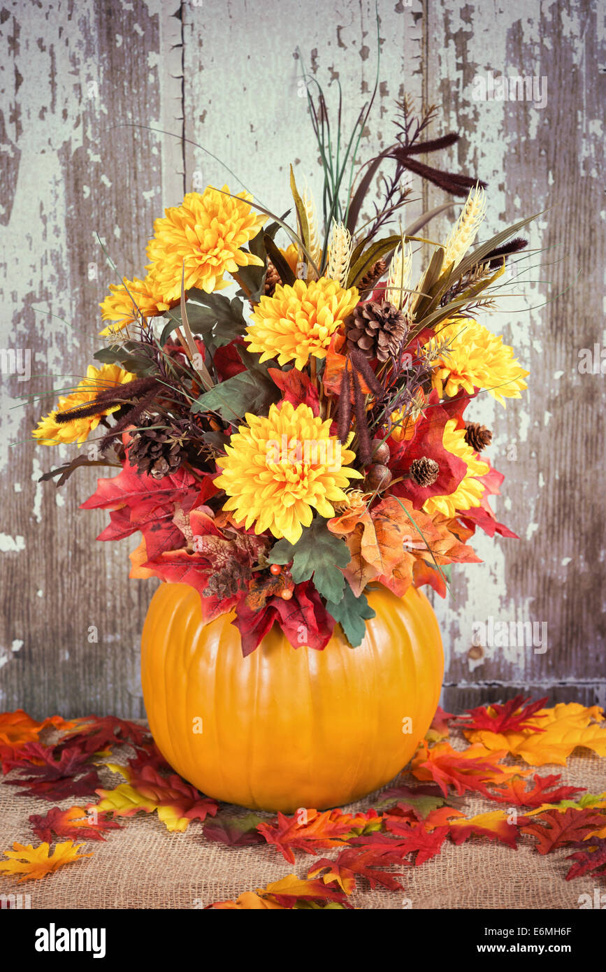 Autumn pumpkin flower arrangement centerpiece Stock Photo