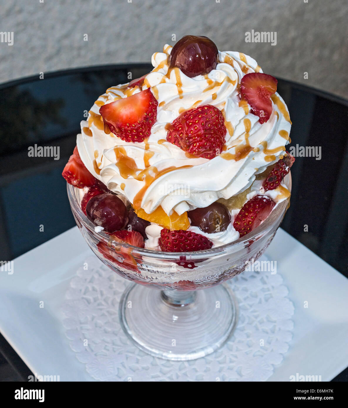 Fresh fruit, whipped cream and caramel sauce dessert Stock Photo Alamy
