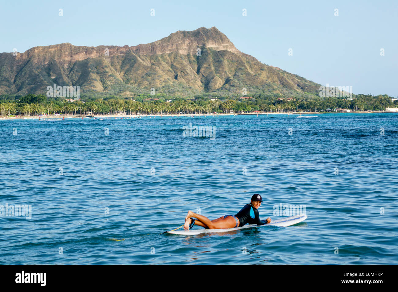 Honolulu Waikiki Beach Hawaii,Hawaiian,Oahu,Pacific Ocean,Waikiki Bay,Diamond Head Crater,extinct volcano,mountain,woman female women,surfer,surfboard Stock Photo