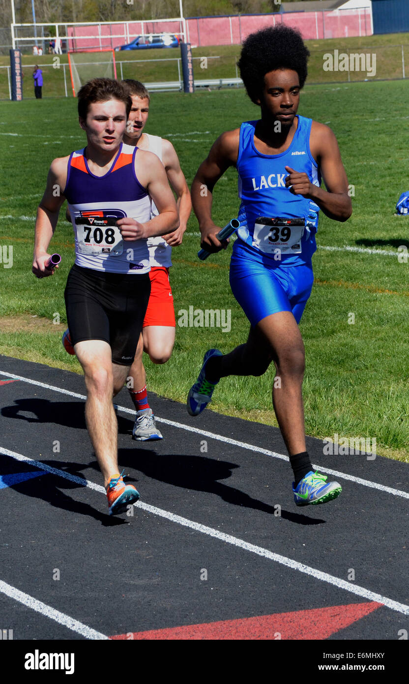High school relay race in track and field meet Stock Photo Alamy