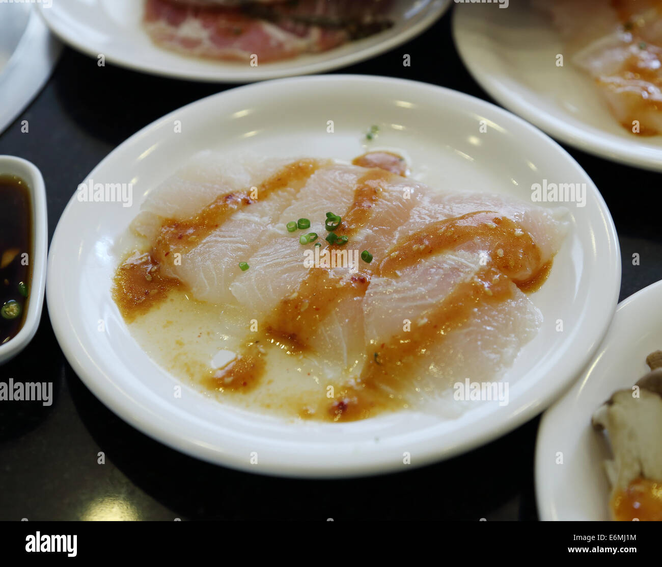 Fish fillet with sauce in plate Stock Photo