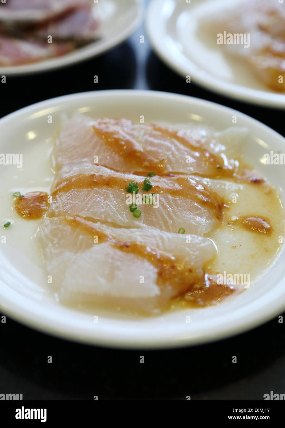 Fish fillet with sauce in plate Stock Photo