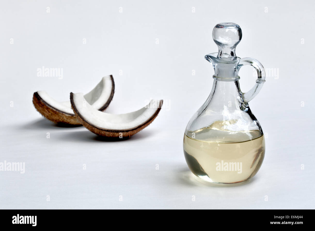 Coconut oil in glass carafe. Stock Photo