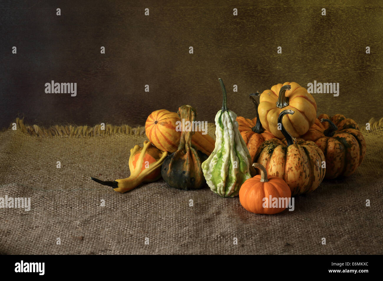 Autumn pumpkins with leaves on wooden board Stock Photo - Alamy