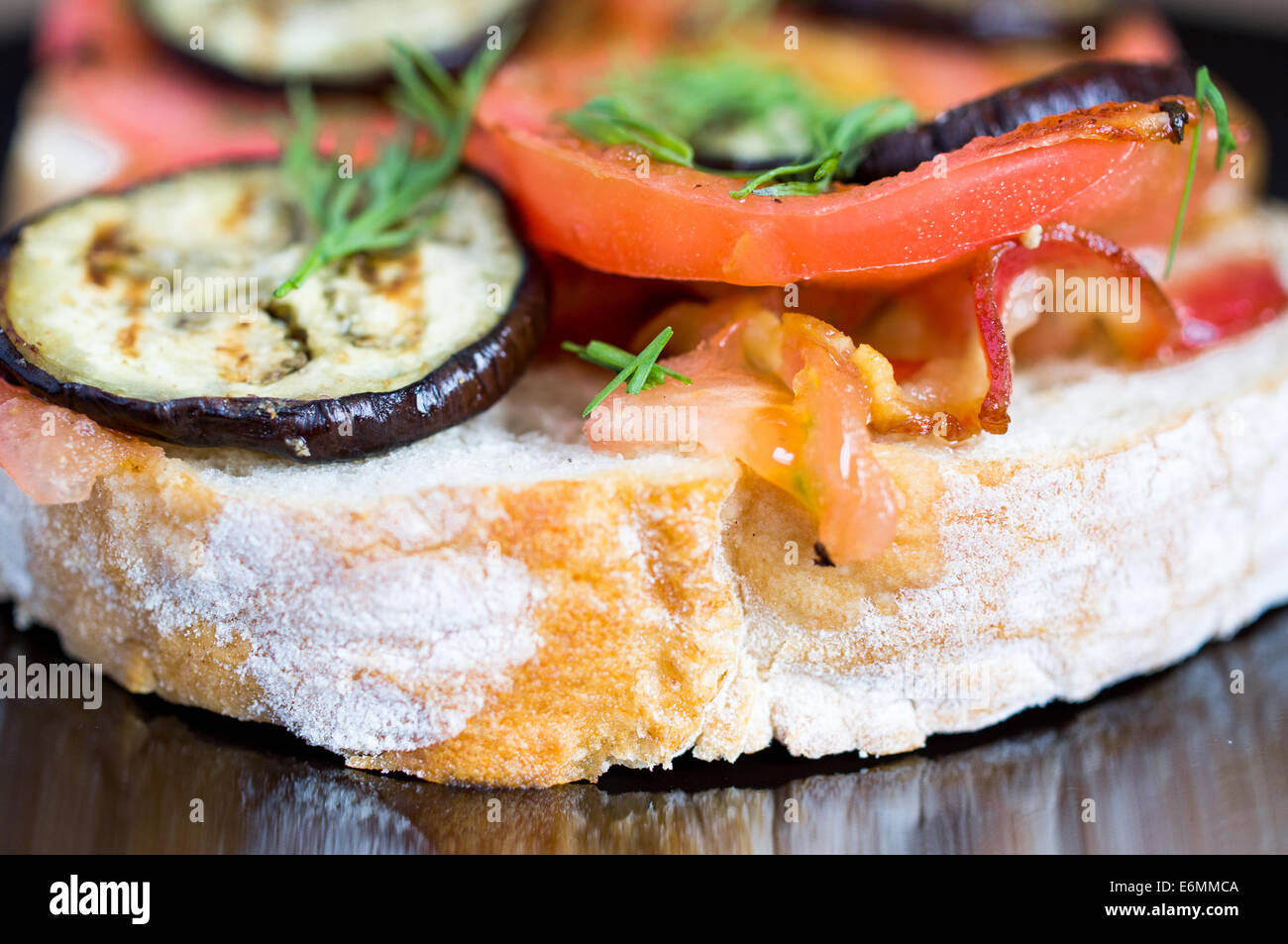 Sandwich with bacon, tomato and eggplant Stock Photo Alamy
