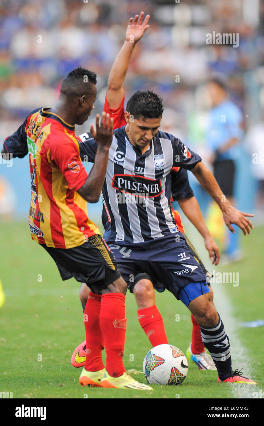 Guayaquil, Ecuador. 26th Aug, 2014. Fernando Gimenez (R) of Emelec, of Ecuador vies for the ball with Carlos Arboleda of Aguilas Doradas, of Colombia, during the match of the South American Cup, held in the George Capwell Stadium, in Guayaquil, Ecuador, on Aug. 26, 2014. © Str/Xinhua/Alamy Live News Stock Photo