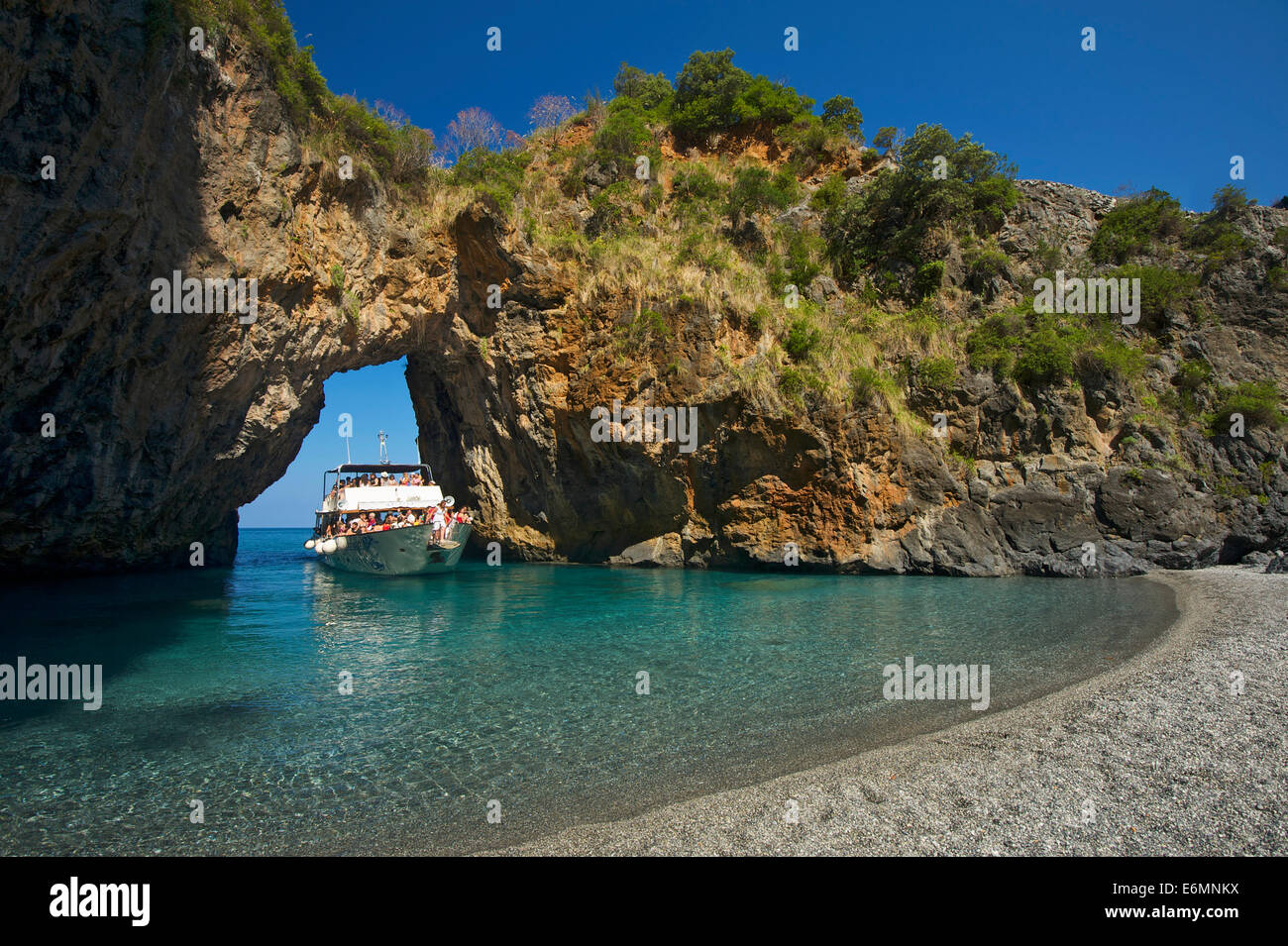Excursion boat, natural arch, Arco Magno, San Nicola Arcella, Capo Scalea, Calabria, Italy Stock Photo
