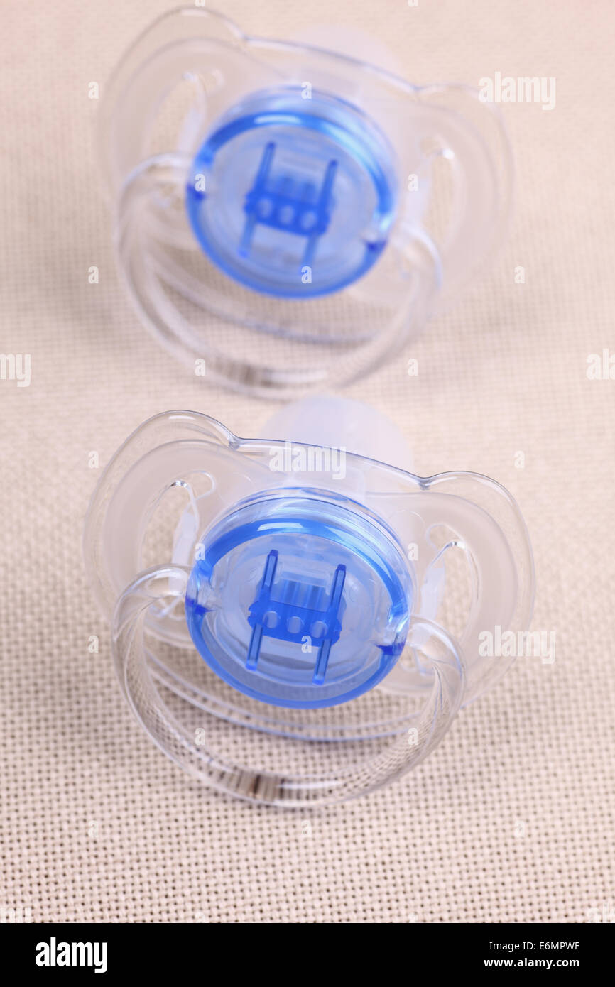 Two baby pacifiers Stock Photo