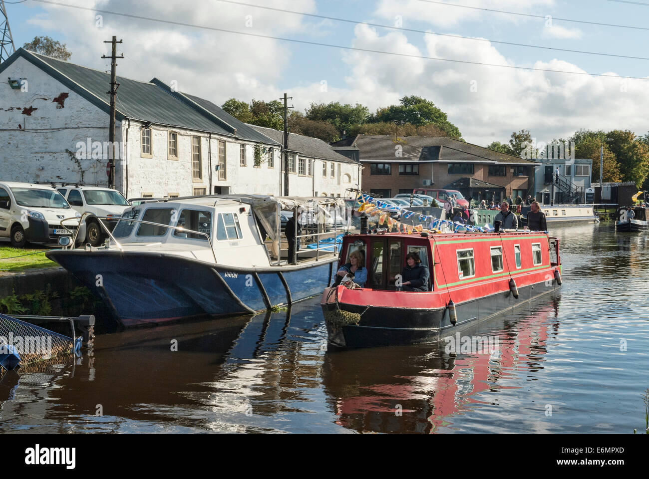Canal Boats sailing as part  of a flotilla at Applecross on the Forth & Clyde Canal. Stock Photo