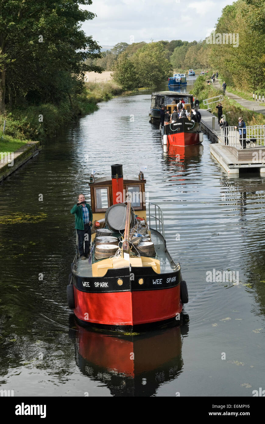 The 'Wee Spark' and 'Maryhill' puffers sailing as part  of a flotilla near Bishopbriggs on the Forth & Clyde Canal. Stock Photo