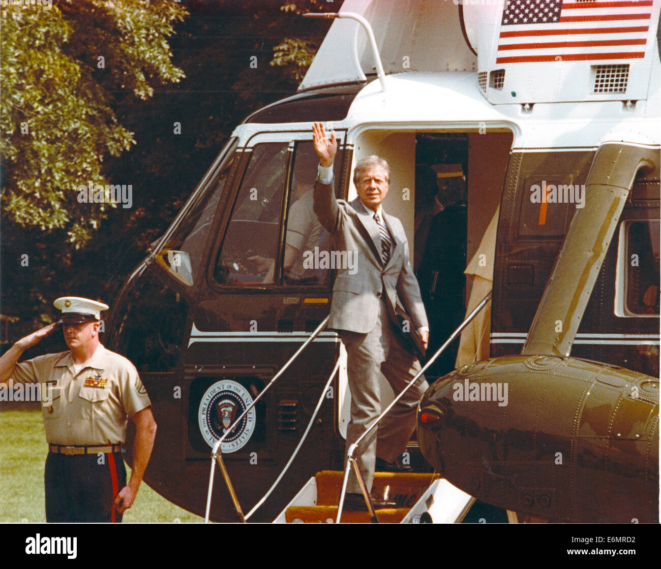 United States President Jimmy Carter waves from the top step of Marine ...