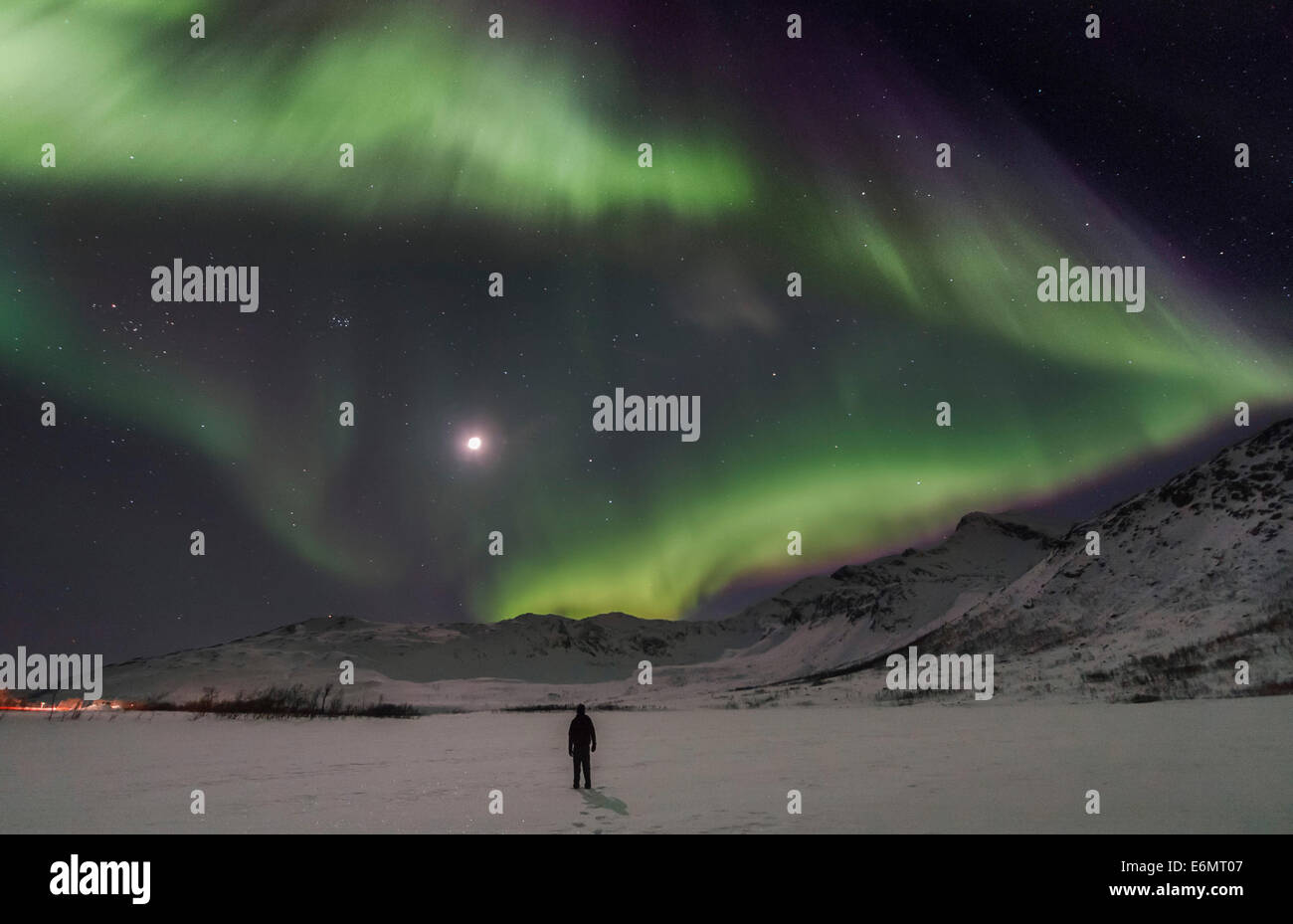kvaloya Aurora borealis or northern lights moving across night sky within the Arctic Circle Troms region of norway Stock Photo