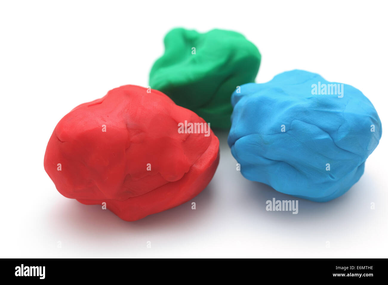 Colorful child's play clay (Red, Green, Blue). Stock Photo