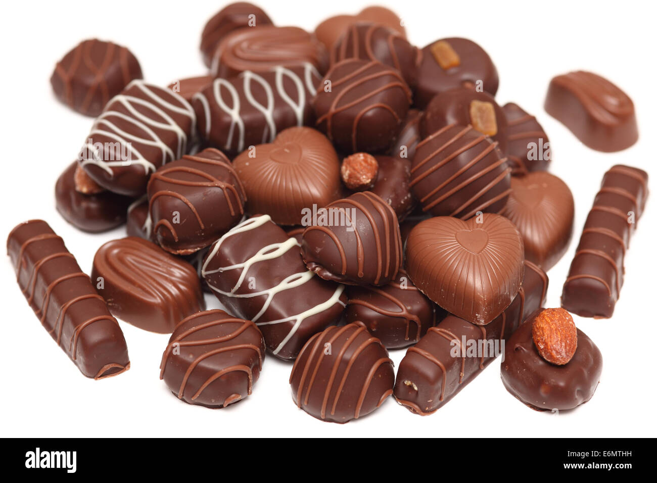 Lots of chocolate. White background. Closeup Stock Photo - Alamy