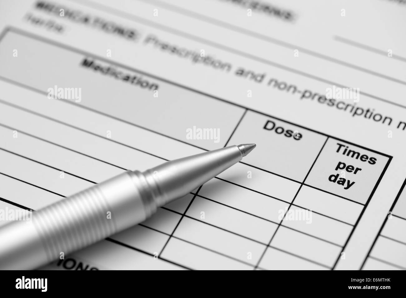 Adult medical history form (medication record) and ballpoint pen. Black