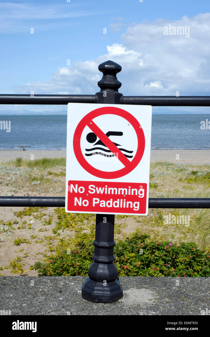No Swimming, No Paddling sign attached to railings on the seafront in Fleetwood, Lancashire Stock Photo