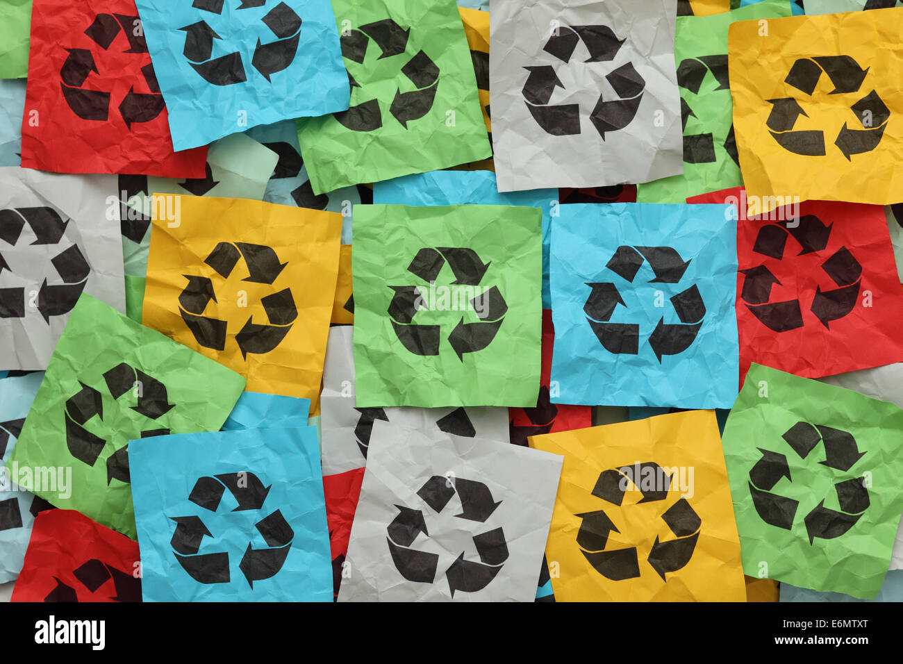 Colorful Clothes And Mini Hungers Under Paper Cut Recycling Symbol