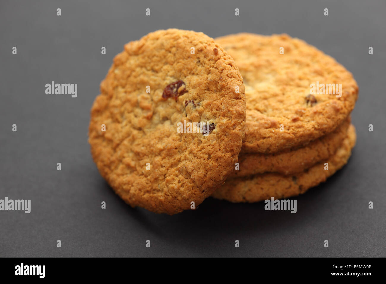 Oatmeal raisin cookies on a black background. Shallow depth of field. Closeup. Stock Photo