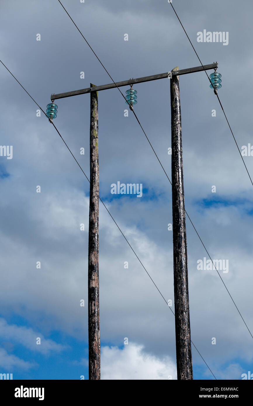 Old wooden electric post against blue sky and beautiful clouds Stock Photo Alamy