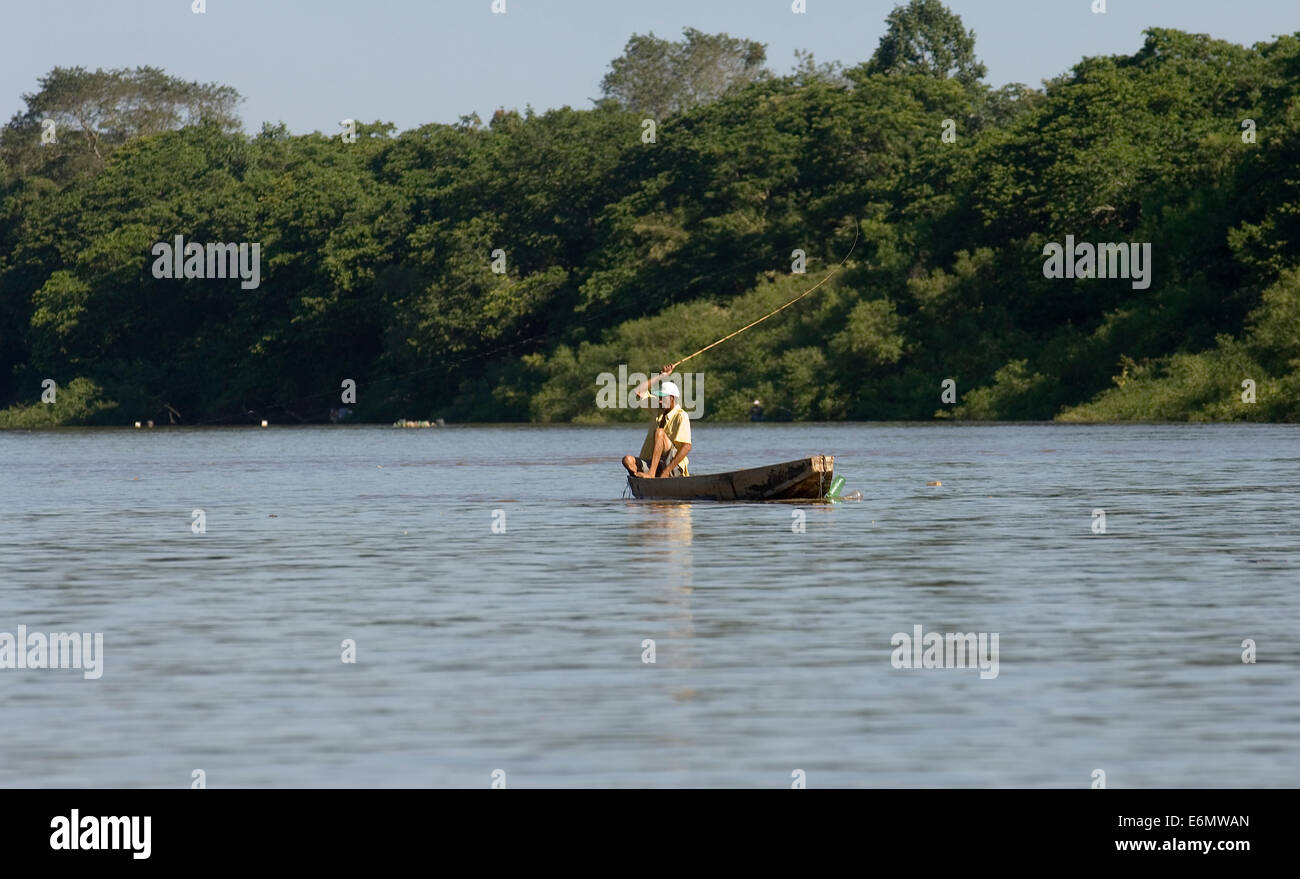 A fisherman in a traditional canoe on the Cubaia river Stock Photo Alamy