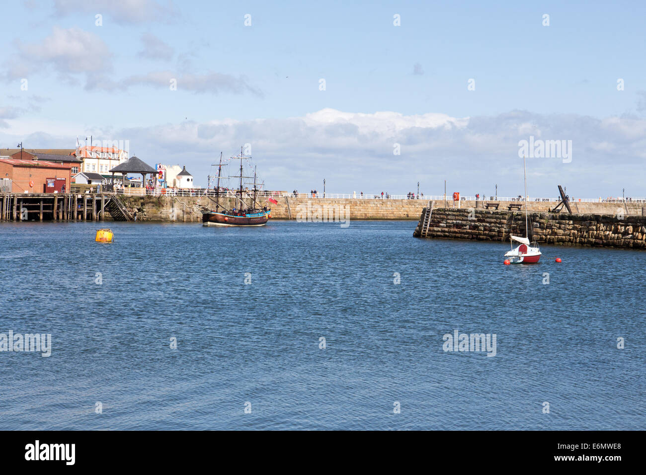 Whitby harbour with an old sailing boat north Yorkshire, England