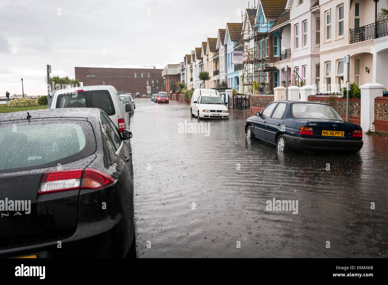 Localised flooding on Worthing seafront after very heavy summer rainfall overloads storm drains. Stock Photo