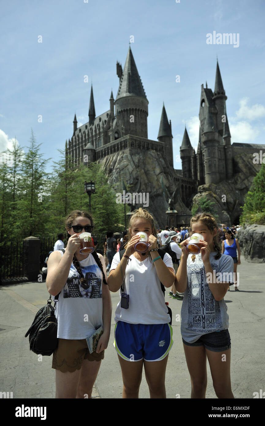 Three young Australian visitors enjoying a drink at Harry Potter World, Universal Orlando Resort, Orlando, Florida, USA Stock Photo