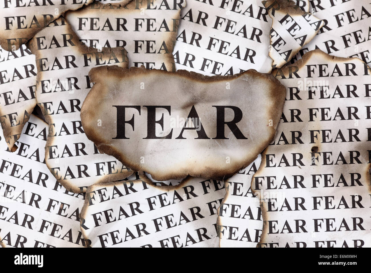Burnt Fear. Burnt pieces of paper with the word "Fear Stock Photo Alamy