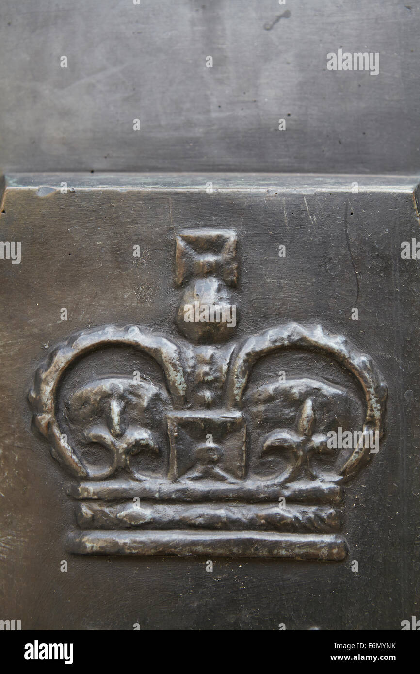 London textures, iron surface with embossed crown. Stock Photo