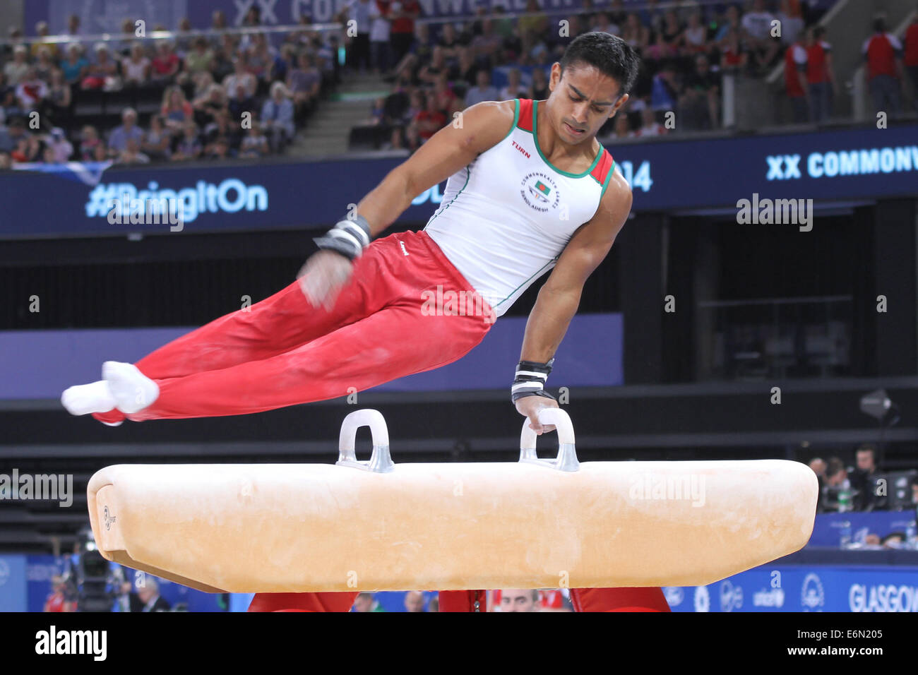 Quazi Syque CAESAR of Bangladesh on the Pommel Horse in the artistic gymnastics at the 2014 Commonwealth games in Glasgow. Stock Photo