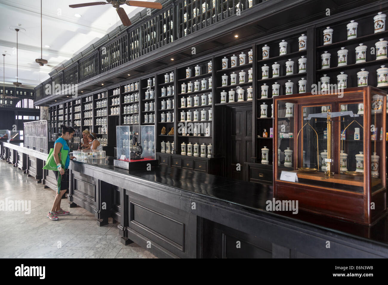 shelves full of apothecary jars, Drogueria Johnson pharmacy, Havana, Cuba Stock Photo