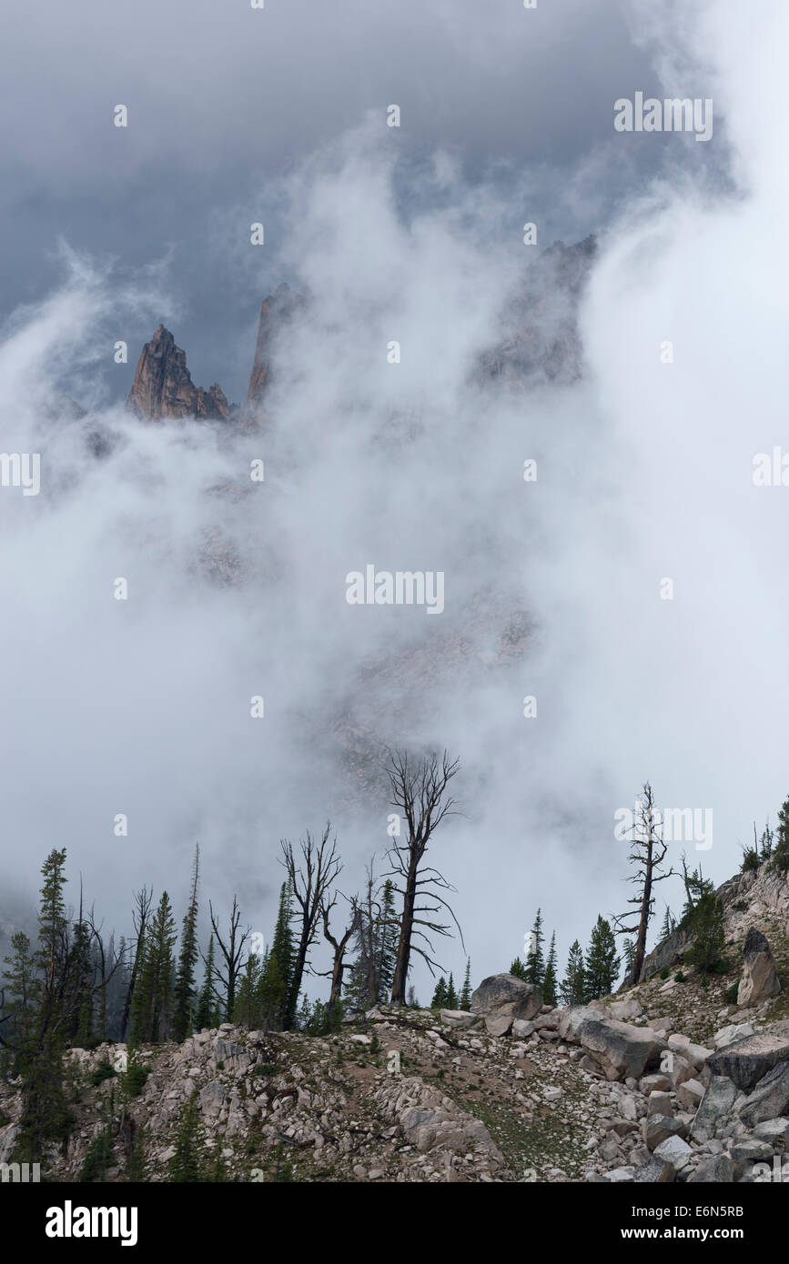 Warbonnet Peak partially obscured by clouds, Sawtooth Mountains, Idaho. Stock Photo