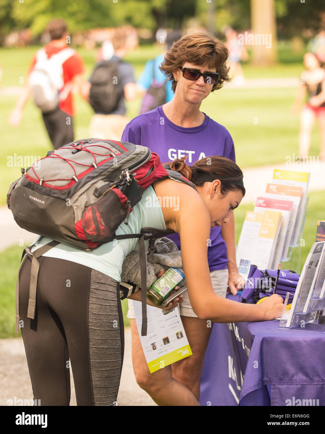 Columbus, Ohio, US. 27th Aug, 2014. Becky Oslendorf of Kaplan signs a student up during the