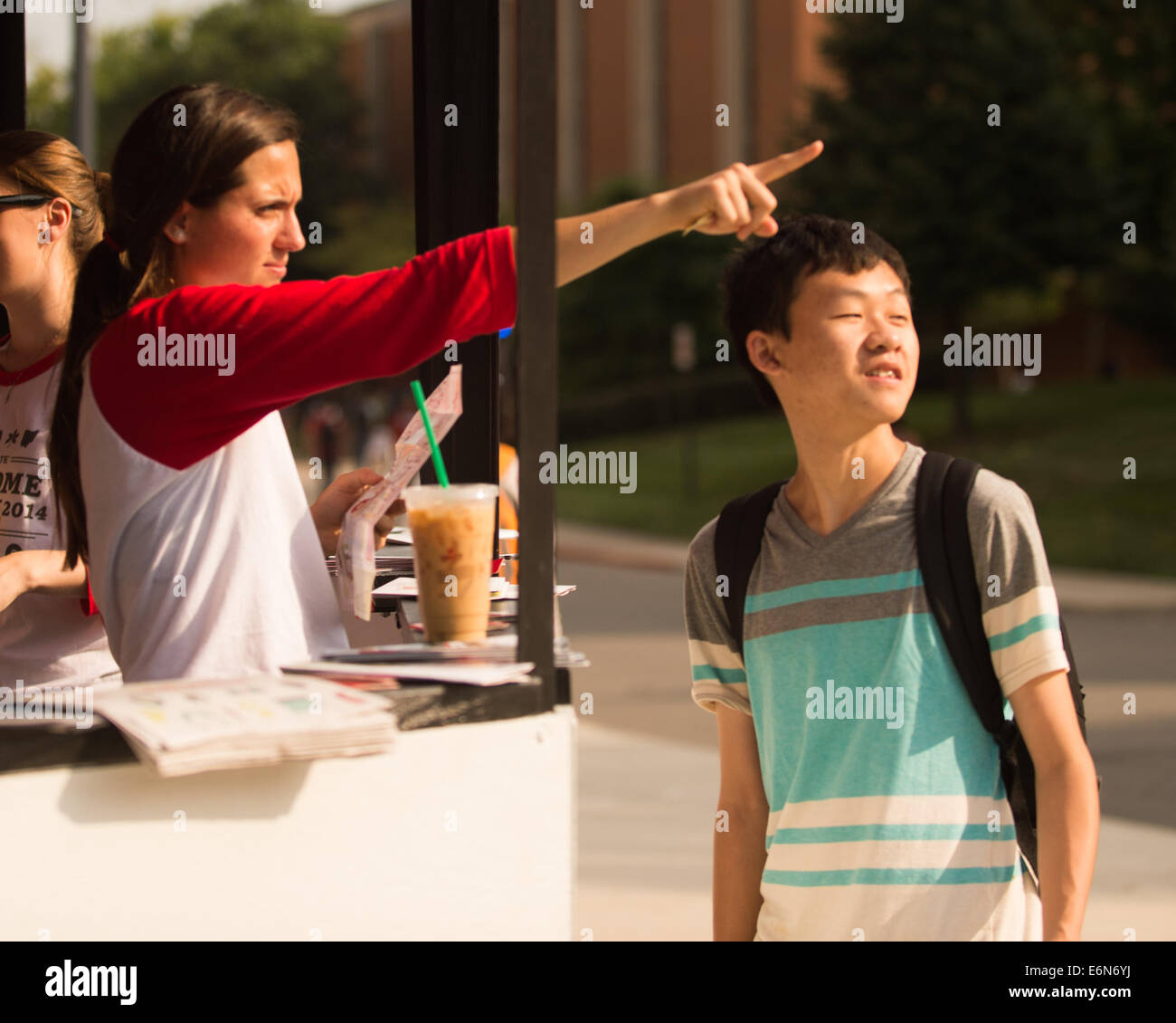 Columbus, Ohio, US. 27th Aug, 2014. OSU Junior Armelle Desiso of the Office of student Life gives directions to a fellow student during the first regular day of classes at The Ohio State University in Columbus, Ohio. Credit:  Brent Clark/Alamy Live News Stock Photo