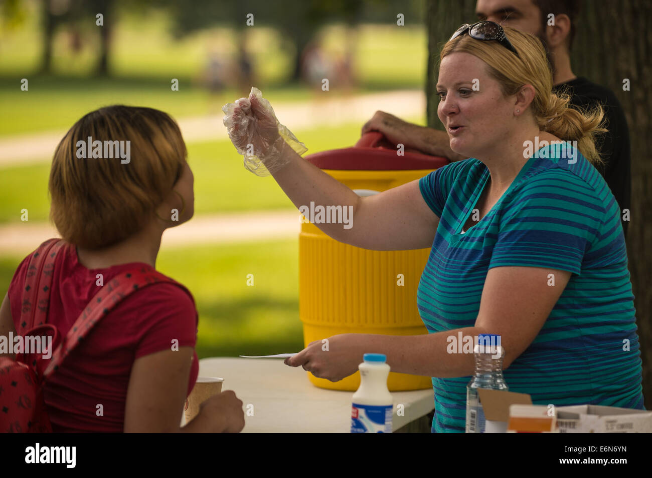 Columbus, Ohio, US. 27th Aug, 2014. Jill Vogel of Student Christian Fellowship interacts with a student during the first regular day of classes at The Ohio State University in Columbus, Ohio. Credit:  Brent Clark/Alamy Live News Stock Photo